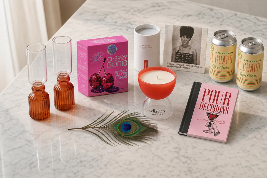 Pour Decisions lifestyle with glitter bombs, BITTERS and SODA cans, and Sharon napkin